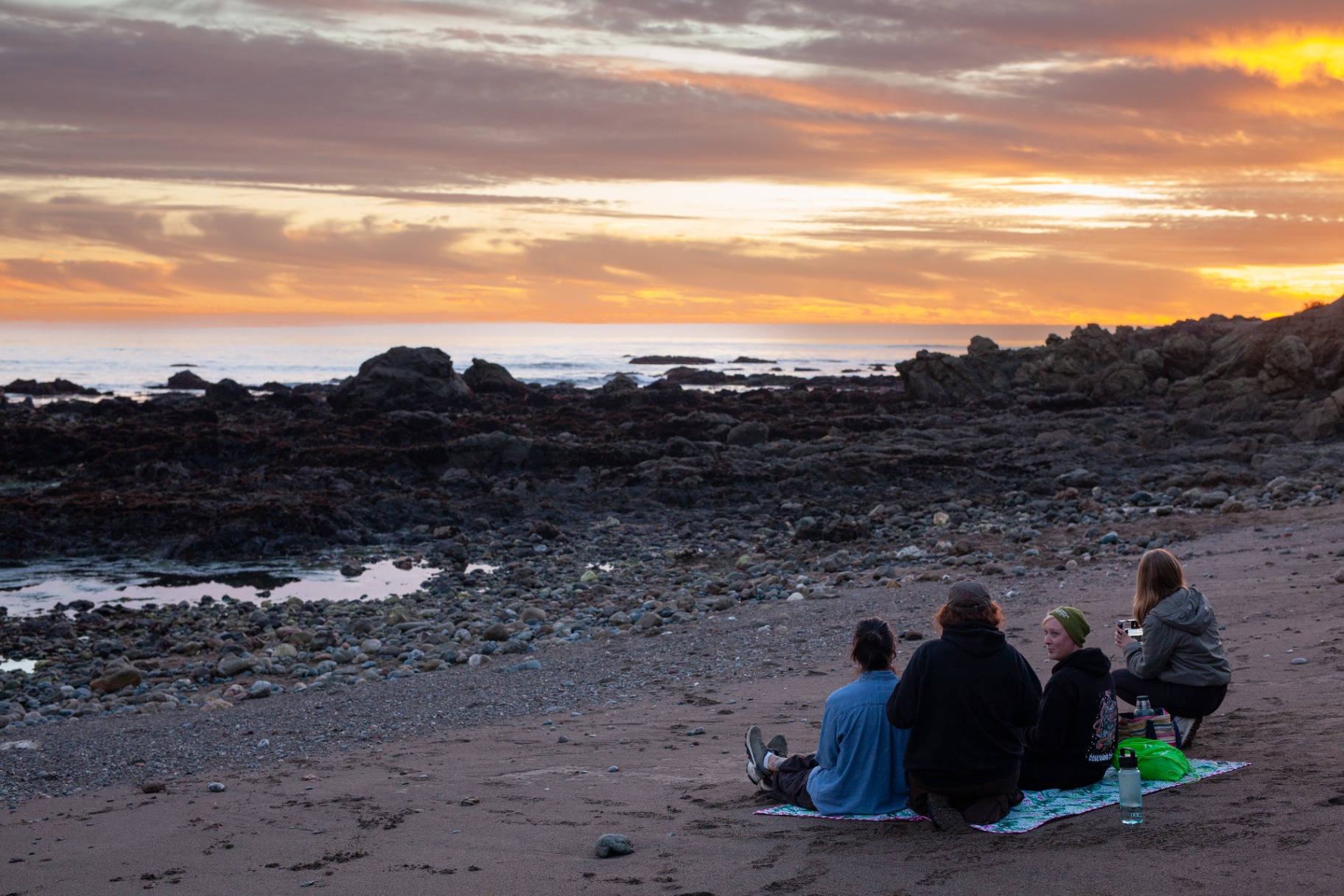 Sunset over a rocky tidepool beach in the Pacific Northwest
